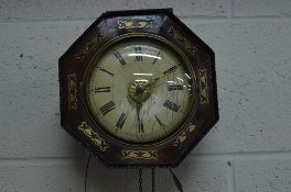 A VICTORIAN ROSEWOOD AND BRASS INLAID OCTAGONAL POSTMAN'S ALARM CLOCK, painted wooden 14.5cm 5 3/4''