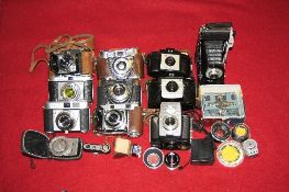 A SELECTION OF VINTAGE KODAK CAMERAS, with a variety of accessories and a camera bag, a Kodak Retina