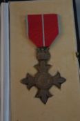 A BOXED M.B.E. (MIL) MEDAL, with correct ribbon, King and Queen obverse