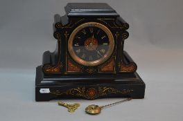 A LATE 19TH CENTURY BLACK SLATE MANTEL CLOCK, flat pediment above scrolled sides on a plinth style