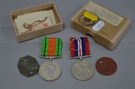 WWII GROUP OF MEDALS IN BOX OF ISSUE, together with original fibre Dog tags, to a female in the