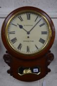 A VICTORIAN WALNUT DROP CASE THIRTY HOUR WALL CLOCK, circular painted 30cm (11 3/4'') painted