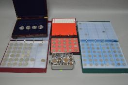 THREE COIN ALBUMS, with many UK coinage and a box of four Crowns sized coins, with lots of silver