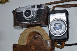 A LEICA M1 CAMERA, and a Gossen Light Meter, the camera serial No.967 045 and comes in its leather