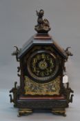 A LATE 19TH CENTURY JAPY FRERES BLACK SLATE AND RED MARBLE AESTHETIC MANTEL CLOCK, bronze horned