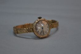 A 9CT GOLD LADIES WRISTWATCH, movement stamped Breguet, on a 9ct expandable strap