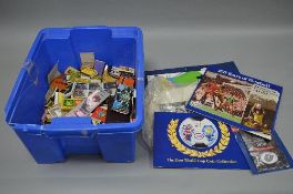 A PLASTIC BOX OF EPHEMERA, to include World Cup Football collectors medals, match and matchbox
