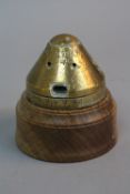 A BRASS FUSE HOUSING FROM A WWI GERMAN ARTILLERY SHELL, possibly 'Shrapnel Bomb' the cone is