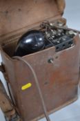 A US SIGNAL CORPS (US ARMY) WWII ERA FIELD TELEPHONE, complete in brown leather case, Model E-E-8-A,