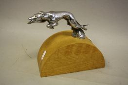 A CHROME PLATED CAR RADIATOR CAP/MASCOT IN THE FORM OF A LEAPING GREYHOUND, length approximately