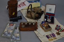 A WWII GROUP OF MEDALS, together with miniatures, ephemera, badges and other items, attributed to