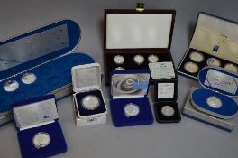 A COLLECTION OF SILVER PROOF COINS, to include Canada Three .925 silver coins highlighted in gold