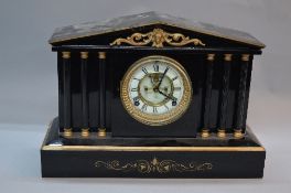 A LATE 19TH CENTURY ANSONIA OF NEW YORK BLACK PAINTED CAST METAL MANTEL CLOCK OF ARCHITECTURAL FORM,