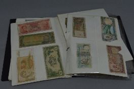 AN ALBUM OF WORLD COINS AND BANKNOTES