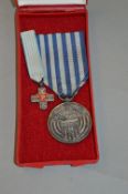 A POLISH 50 YEAR COMMEMORATIVE MEDAL 1946-96, circular design, with ribbon in original box of issue,