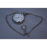 A WALTHAM SILVER OPEN FACED POCKET WATCH, on a silver T Bar chain and fob (loose secondary hand)