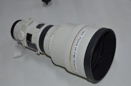 A MINOLTA HIGH SPEED APO AF 300 LENS, working order but slight dent on front edge