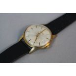 A 9CT GOLD GENTS GARRARD AUTOMATIC WRISTWATCH, leather strap, 21 jewels MSR576 (in original box)