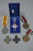 A SMALL COLLECTION OF GERMAN WWII MEDALS, consisting of a Mothers Cross, in original box in