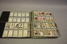 TWO ALBUMS OF CIGARETTE CARDS, comprising predominantly full sets with a small number of part