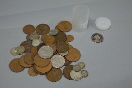 A TIN CONTAINING A SMALL AMOUNT OF COINAGE, to include a George I Roses & Plumes 1722 shilling coin