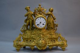 A LATE 19TH CENTURY FRENCH GILT METAL EIGHT DAY MANTEL CLOCK BY MARTI & CO, the ornate case cast