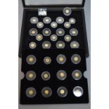 THE WORLDS SMALLEST GOLD COINS, thirty two 1/2oz .999 gold miniatures from Panda to Angel, boxed (