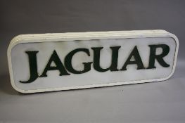 AN INTERNALLY ILLUMINATED METAL AND PLASTIC HANGING SINGLE SIDED SHOWROOM DISPLAY SIGN 'JAGUAR', not