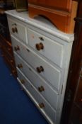 A PAINTED PINE CHEST, of five drawers with turned handles and bun feet (key)