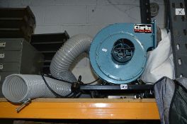 A CLARKE WOODWORKER DUST EXTRACTOR, with hose and bag