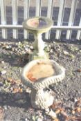 TWO VARIOUS COMPOSITE BIRD BATHS, one 60cm high x 35cm diameter, the other shaped in the form of a
