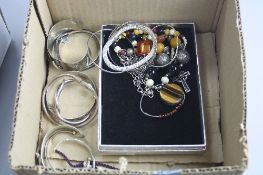 A TRAY OF BANGLES AND NECKLACES, etc