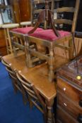 AN OAK DRAW LEAF TABLE, and four chairs (5)