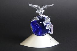 A BOXED SWAROVSKI 'CRYSTAL PLANET VISION 2000', with Dove holding leaf, also with paperwork