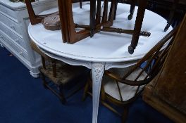 A PAINTED OVAL DINING TABLE, approximate diameter 119.5cm