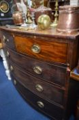 A GEORGIAN MAHOGANY BOW FRONT CHEST, of two short and three long drawers with brass handles (sd,