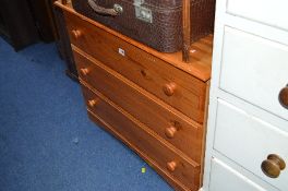 A MODERN PINE CHEST OF THREE DRAWER DRAWERS