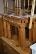 A MEXICAN PINE NEST OF THREE TABLES, with tiled top