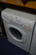 A HOTPOINT WD440 WASHING MACHINE, in white and a microwave (2)