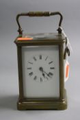 A BRASS CARRIAGE CLOCK, approximate height 12cm (key)