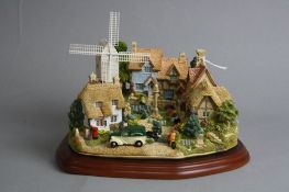 A BOXED LIMITED EDITION LILLIPUT LANE SCULPTURE 'The Village Green' L2558, 871/2500, with plinth and