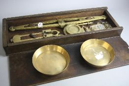 A CASED SET OF LATE VICTORIAN BRASS P.ROGERS & CO PATENT AGATE WEIGHING SCALES, in a fitted box,