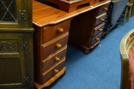 A PINE DRESSING TABLE, with eight various drawers