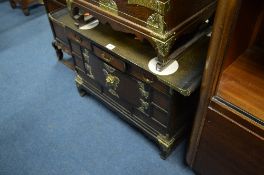 A SMALL ORIENTAL STYLE BRASS BOUNDED CABINET, with three small drawers above a small double