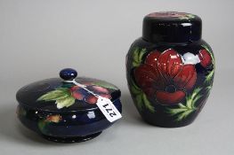TWO PIECES OF MOORCROFT POTTERY, a 'Pansy' powder bowl and cover, impressed and painted backstamp,