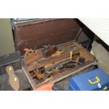 A CARPENTERS TOOL CHEST CONTAINING VINTAGE TOOLS, including wooden moulding planes, saws, chisels