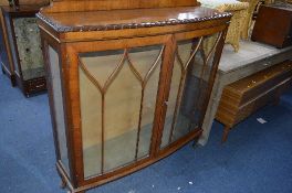 A WALNUT TWO DOOR CHINA CABINET, with single drawer