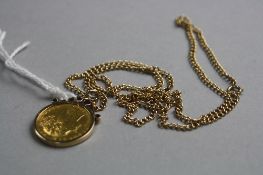 AN 1864 GOLD HALF SOVEREIGN, in a 9ct mount and chain, approximate weight 16.9 grams