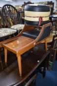 A TEAK TELEPHONE SEAT, two metal framed bar stools, two leather pouffe's and two mirrors (7)