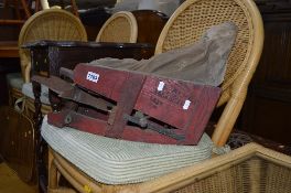 A VINTAGE SEED SOWER, an oak barley twist occasional table and a tin trunk (sd) (3)